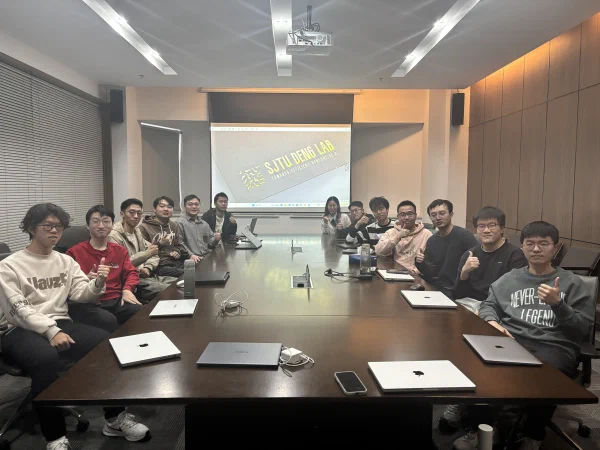 DENG Lab members gathered in a meeting room.
